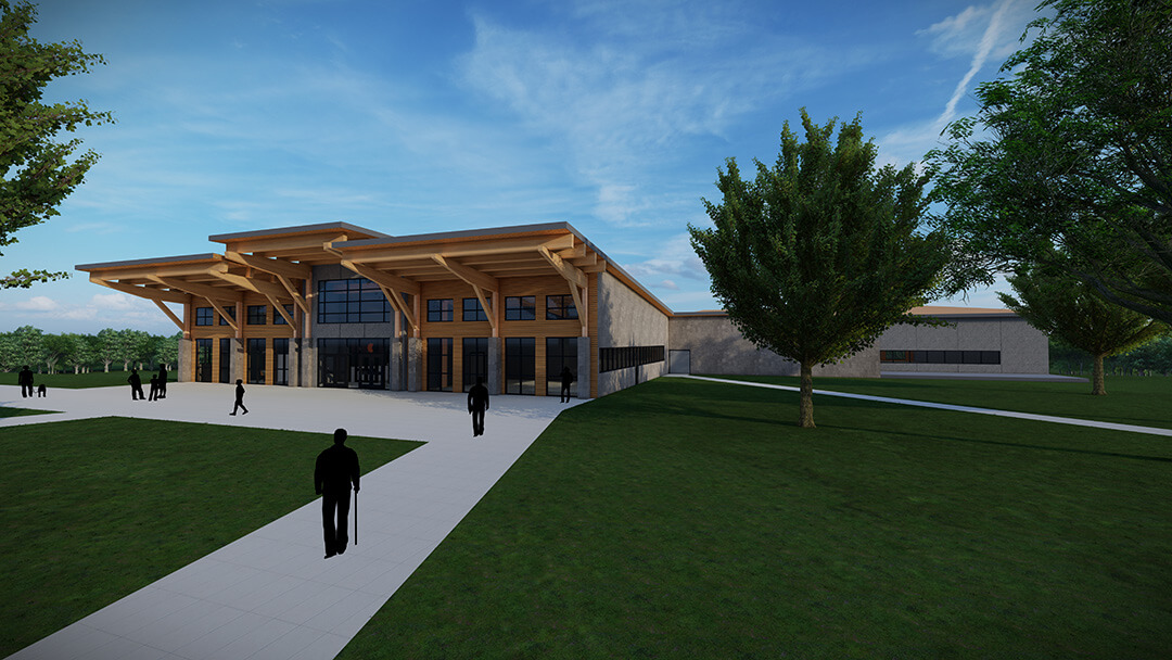 Modern building exterior with large wooden beams and glass facade, surrounded by green lawns and pathways, under a blue sky.