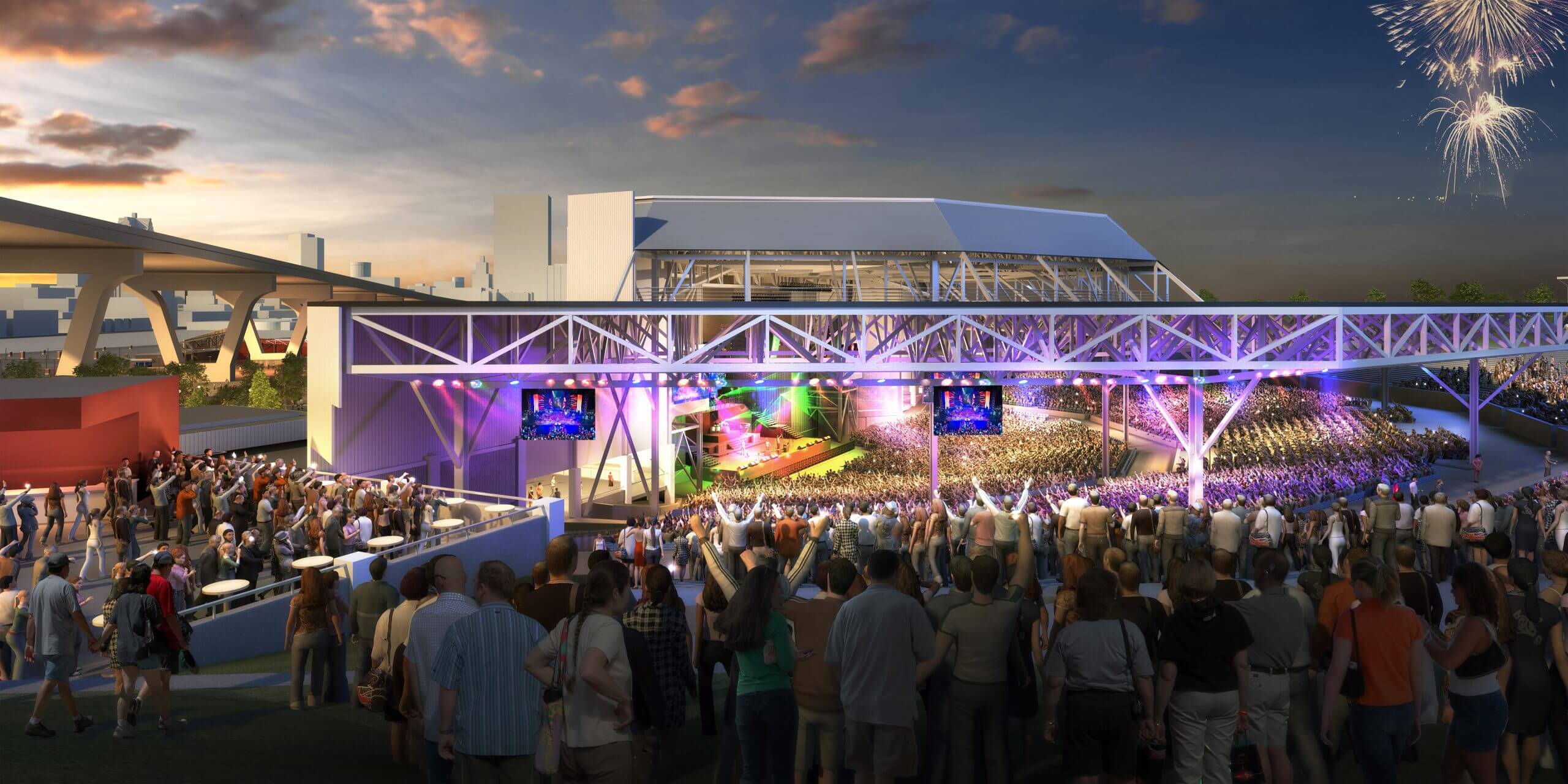 Crowd gathered at the American Family Insurance Amphitheater in Milwaukee, with a stage lit up for a performance and fireworks in the sky.